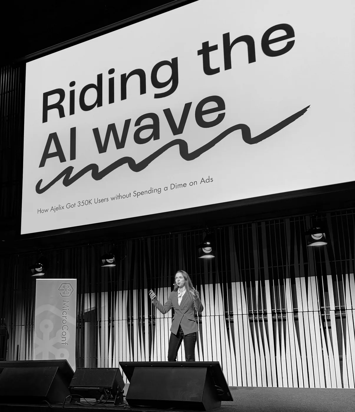 Agnese Jaunošāne at MicroConf Europe 2026: Next up we’ll learn how to get 350k users organically using AI.
